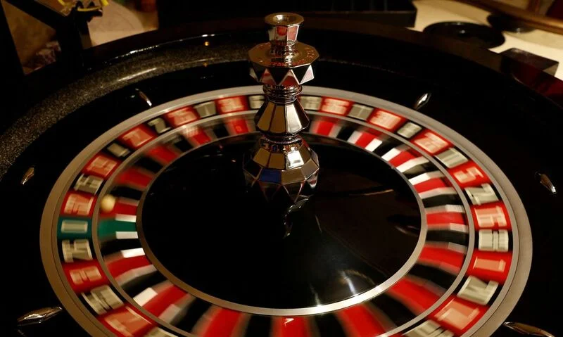 FILE PHOTO: The spinning wheel on a Roulette table is seen at the Dragonara Casino in St Julian